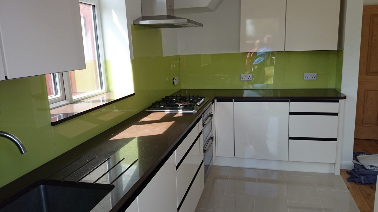 Lime green glass kitchen splashback installed by Pimlico glaziers